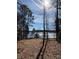 Scenic lake view property featuring a gazebo and dock, perfect for waterfront enjoyment and relaxation at 155 Eagle Chase Ln, Troutman, NC 28166