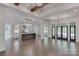 Bright, open living space with hardwood floors, a modern kitchen, and large windows at 155 Eagle Chase Ln, Troutman, NC 28166