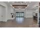 Bright, open living space with hardwood floors, fireplace, and large windows at 155 Eagle Chase Ln, Troutman, NC 28166