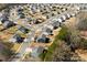 Aerial view of a well-maintained suburban neighborhood with winding streets and mature trees at 15916 Foreleigh Rd, Huntersville, NC 28078