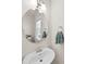 Bathroom featuring a round mirror and white vanity with chrome fixtures at 15916 Foreleigh Rd, Huntersville, NC 28078