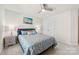Comfortable bedroom featuring a ceiling fan, a double door closet and plush carpet at 15916 Foreleigh Rd, Huntersville, NC 28078
