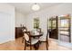 Charming dining area with a round wooden table, comfortable seating, and ample natural light at 15916 Foreleigh Rd, Huntersville, NC 28078