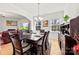 Traditional dining room features hardwood floors, wainscoting, a stylish chandelier and seating for six at 15916 Foreleigh Rd, Huntersville, NC 28078