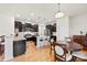 Modern kitchen with granite countertops, stainless steel appliances, and an island with barstools at 15916 Foreleigh Rd, Huntersville, NC 28078