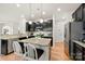 Beautiful kitchen with granite countertops, stainless steel appliances, and a center island with bar seating at 15916 Foreleigh Rd, Huntersville, NC 28078