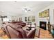 Inviting living room with fireplace and comfortable seating area for relaxing or entertaining guests at 15916 Foreleigh Rd, Huntersville, NC 28078