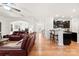 Open-concept living room seamlessly connects to the kitchen, featuring a breakfast bar and ample seating at 15916 Foreleigh Rd, Huntersville, NC 28078
