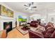 Spacious living room features hardwood floors, a fireplace, modern decor and an open floor plan at 15916 Foreleigh Rd, Huntersville, NC 28078