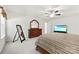 Bright main bedroom featuring carpet, a large bed with a wooden frame and television at 15916 Foreleigh Rd, Huntersville, NC 28078