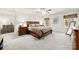 Main bedroom featuring carpet, large bed with wood frame and two windows at 15916 Foreleigh Rd, Huntersville, NC 28078
