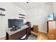 Bright office space with wood floors, built-in shelving, and a large desk for productive work from home at 15916 Foreleigh Rd, Huntersville, NC 28078