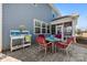 A cozy outdoor dining area with a patio, outdoor furniture, and manicured landscaping at 15916 Foreleigh Rd, Huntersville, NC 28078