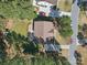A bird's eye view showcases this charming single-Gathering home with a well-maintained lawn and mature trees at 160 Belfry Loop, Mooresville, NC 28117