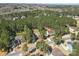 An aerial shot displays a neighborhood surrounded by lush trees, highlighting community and natural beauty at 160 Belfry Loop, Mooresville, NC 28117