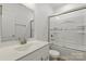 Bright bathroom showcasing a vanity with a sink and tub/shower combo with glass doors at 160 Belfry Loop, Mooresville, NC 28117