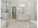 Elegant bathroom featuring a glass-enclosed shower, double vanity, and a view into the walk-in closet at 160 Belfry Loop, Mooresville, NC 28117