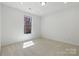 Bright bedroom featuring a window and neutral carpeting at 160 Belfry Loop, Mooresville, NC 28117