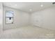 Cozy bedroom featuring a window with natural light and a double-door closet at 160 Belfry Loop, Mooresville, NC 28117