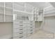 Well-organized walk-in closet with custom shelving, drawers, and ample storage space at 160 Belfry Loop, Mooresville, NC 28117
