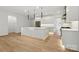 Open-concept kitchen boasts a large center island, modern lighting, and stainless steel appliances at 160 Belfry Loop, Mooresville, NC 28117