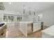 Open-concept kitchen with a large center island, stainless steel appliances, and hardwood floors at 160 Belfry Loop, Mooresville, NC 28117