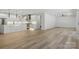 Open concept kitchen and living room area with modern lighting at 160 Belfry Loop, Mooresville, NC 28117