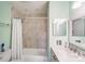 Renovated bathroom featuring a marble-tiled shower and new vanity with undermount sink and modern fixtures at 1606 Sharon W Rd, Charlotte, NC 28210