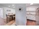 Kitchen and dining area with white cabinets and hardwood floors at 1606 Sharon W Rd, Charlotte, NC 28210