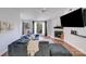Inviting living room with hardwood floors, a cozy fireplace, and plenty of natural light at 1606 Sharon W Rd, Charlotte, NC 28210