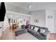 Spacious living room with hardwood floors, couch, and an open concept dining area at 1606 Sharon W Rd, Charlotte, NC 28210