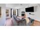 Bright living room boasts hardwood floors, modern furniture, and a fireplace at 1606 Sharon W Rd, Charlotte, NC 28210