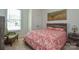 Well-lit bedroom with ample storage space, ceiling fan and plush carpet, offering a warm and inviting atmosphere at 1638 Sweetmoss Loop, Denver, NC 28037