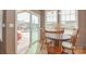 Cozy breakfast nook with views of the pool and backyard, with sliding glass doors to access the yard at 1638 Sweetmoss Loop, Denver, NC 28037