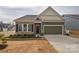 Charming single-Gathering home featuring a brick and siding facade, a two-car garage, and a well-manicured lawn at 1638 Sweetmoss Loop, Denver, NC 28037