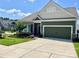 Charming home featuring a well-manicured lawn, beautiful landscaping, and a two-car garage at 1638 Sweetmoss Loop, Denver, NC 28037