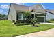 Beautifully landscaped home with brick accents and a lush green lawn at 1638 Sweetmoss Loop, Denver, NC 28037