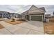 Charming single-Gathering home featuring a brick and siding facade, a two-car garage, and a well-manicured lawn at 1638 Sweetmoss Loop, Denver, NC 28037