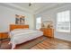 Inviting main bedroom with ceiling fan, tray ceiling, ensuite bathroom and lots of natural light at 1638 Sweetmoss Loop, Denver, NC 28037