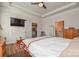 Spacious main bedroom with ceiling fan, tray ceiling, ensuite bathroom and walk-in closet for ample storage space at 1638 Sweetmoss Loop, Denver, NC 28037