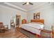 Bright main bedroom with ceiling fan, tray ceiling, ensuite bathroom and walk-in closet for ample storage space at 1638 Sweetmoss Loop, Denver, NC 28037