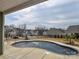 Inviting backyard pool surrounded by a concrete deck and view of neighboring homes at 1638 Sweetmoss Loop, Denver, NC 28037