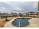 Backyard pool with concrete deck and metal handrail, surrounded by neighboring properties at 1638 Sweetmoss Loop, Denver, NC 28037