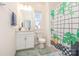 Bright bathroom with a shower curtain, vanity with a cabinet and mirror, and a toilet at 165 Winterberry St, Mooresville, NC 28117