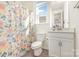 Bathroom with a shower curtain, mirror, vanity with a cabinet, and a toilet at 165 Winterberry St, Mooresville, NC 28117
