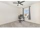 Comfortable bedroom with neutral carpet, ceiling fan, and a desk that sits beneath a window at 165 Winterberry St, Mooresville, NC 28117