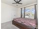 Cozy bedroom with plush carpeting, a ceiling fan, and windows providing natural light at 165 Winterberry St, Mooresville, NC 28117