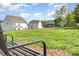 A serene community park offers a peaceful escape with lush green space and houses nearby at 165 Winterberry St, Mooresville, NC 28117