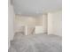 A bright living room area with plush carpeting, neutral walls, and staircase at 165 Winterberry St, Mooresville, NC 28117