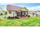 Manicured backyard with vibrant green lawn, complemented by the home's screened in porch at 1674 Wakefield Way, Rock Hill, SC 29730